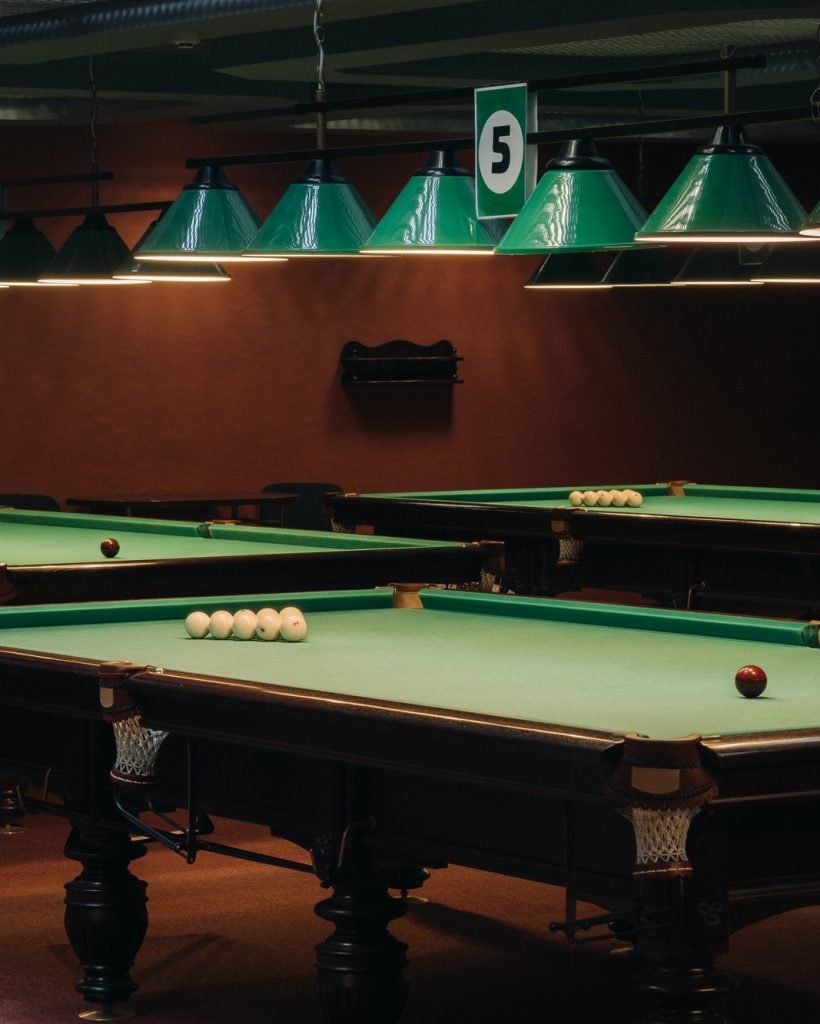 billiard-table-with-green-surface-and-balls-in-the-billiard-club-pool-game-6.jpg